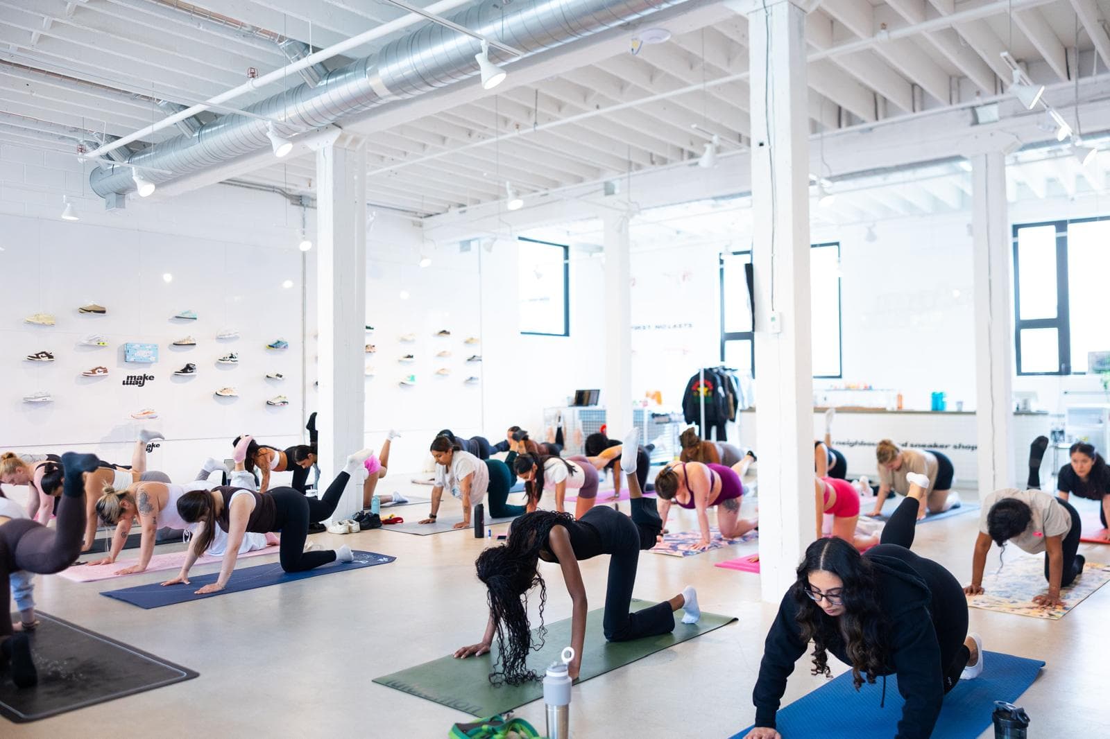 A group Pilates-style class in a bright studio